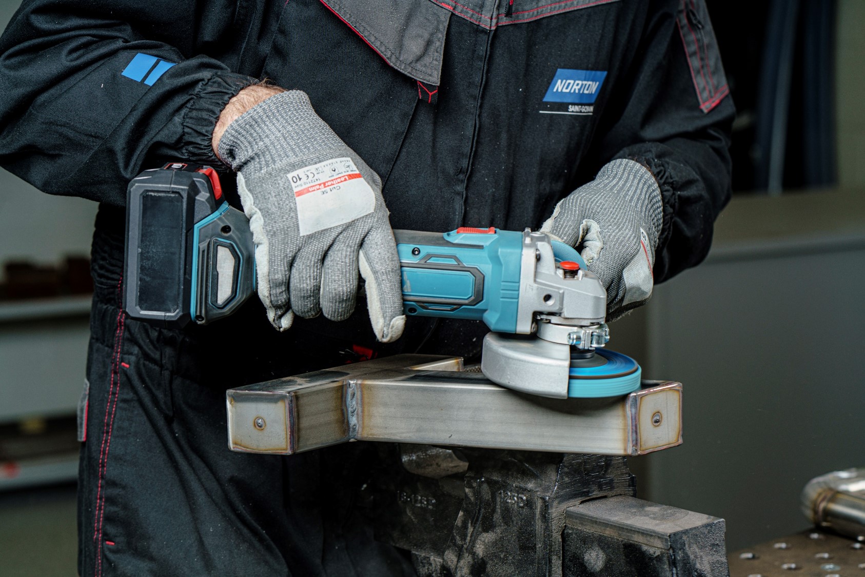 What are the Primary Applications of a Cordless Angle Grinder in Construction?